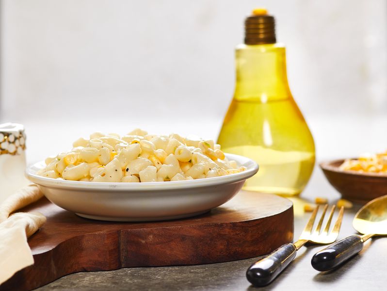 Creamy house-made macaroni salad with celery and pickles